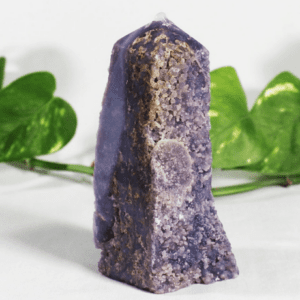 Purple crystal tower with leafy background